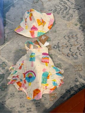 Angel Dear Cream Muslin Swaddle with Rainbow Print